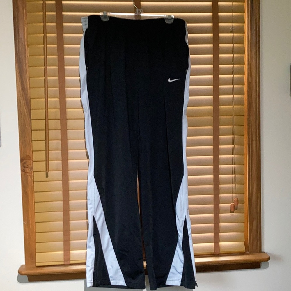 Nike men’s athletic pants. Black and white. Extra large tall zipper pockets.